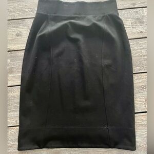 Black jersey pencil skirt with elastic waist.